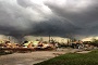 A storm packing rare dual tornadoes tore through the tiny farming town of Pilger in northeast Nebraska, killing two people, crumpling grain bins like discarded soda cans and flattening dozens of homes.